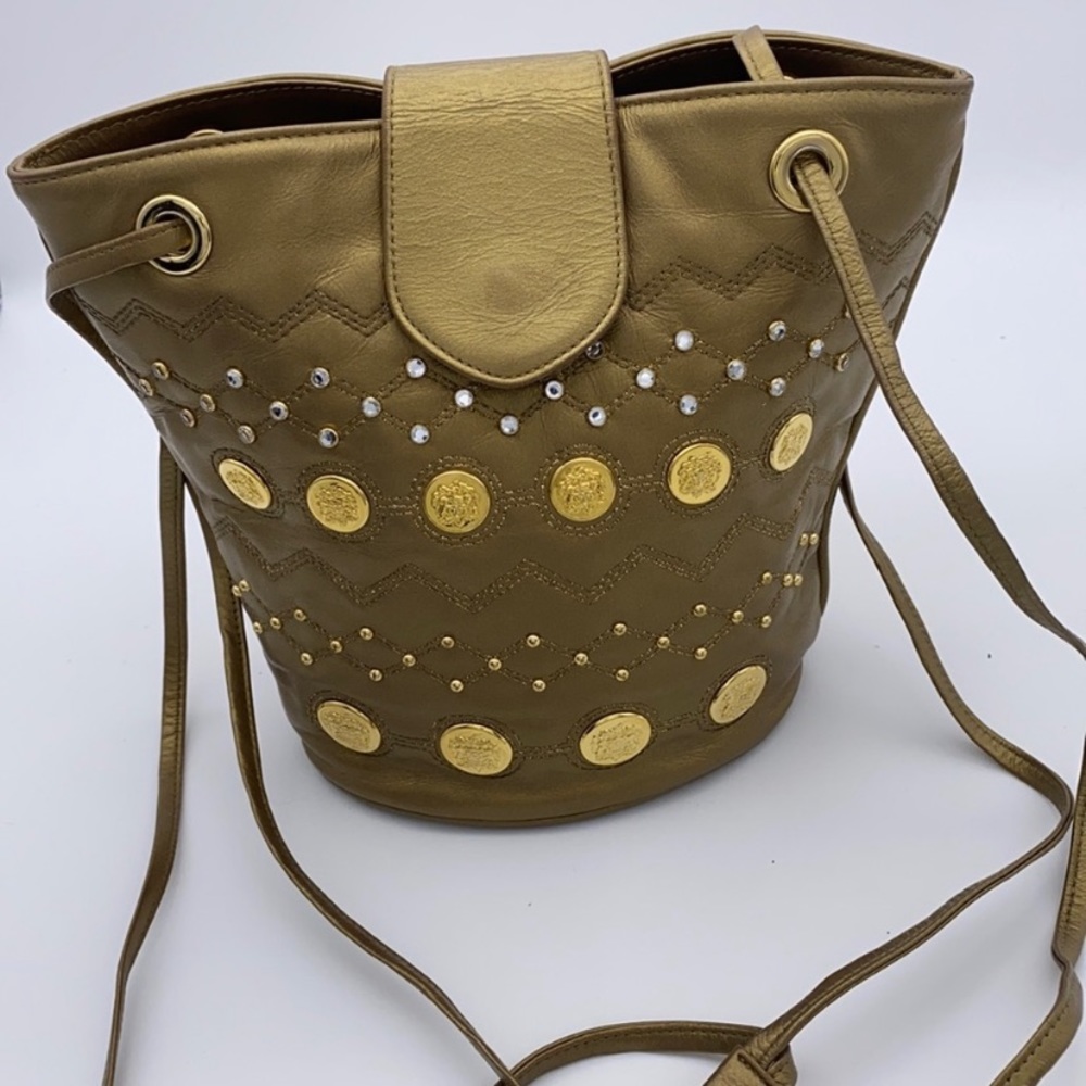 STUART WEITZMAN gold bucket medallion crossbody